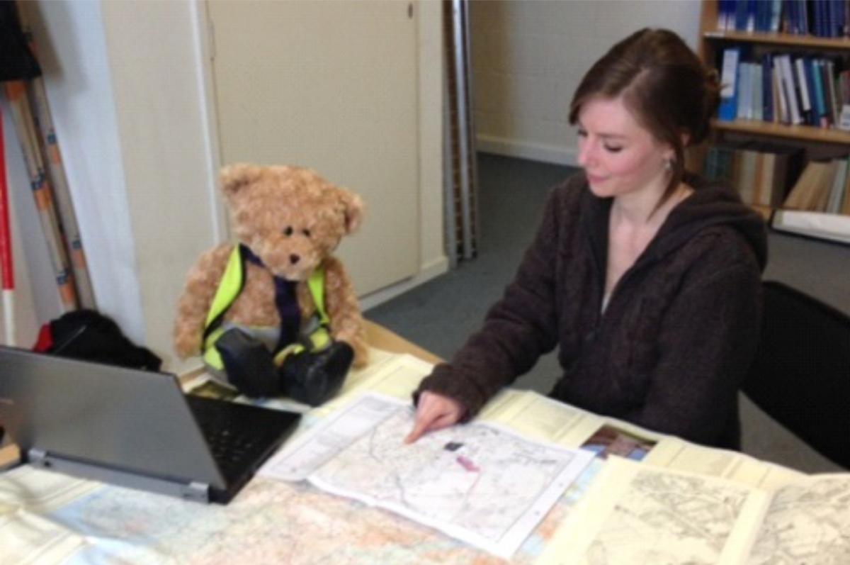 Kent Jones bear archaeologist helping a heritage consultant with mapping