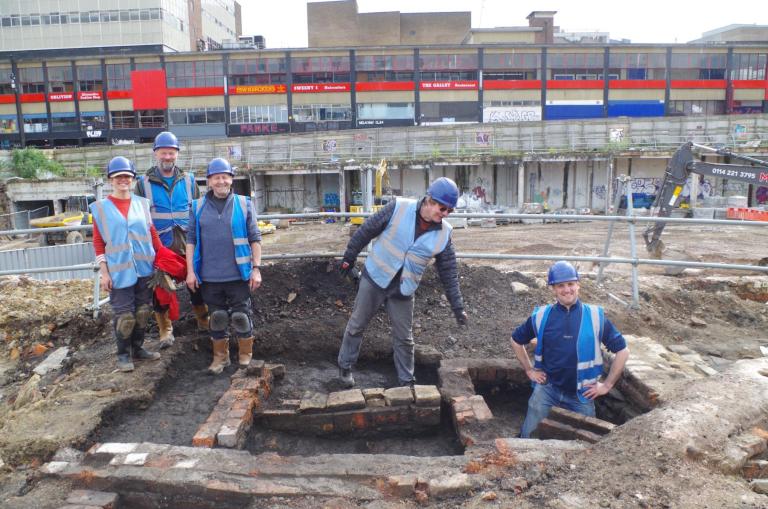 Sheffiel's Castle: voices from the community dig and smiley faces and blue hi vis from the participants 