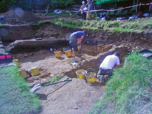Excavation continues in the area of the forecourt while visitors tour the site and watch the excavation in progress.