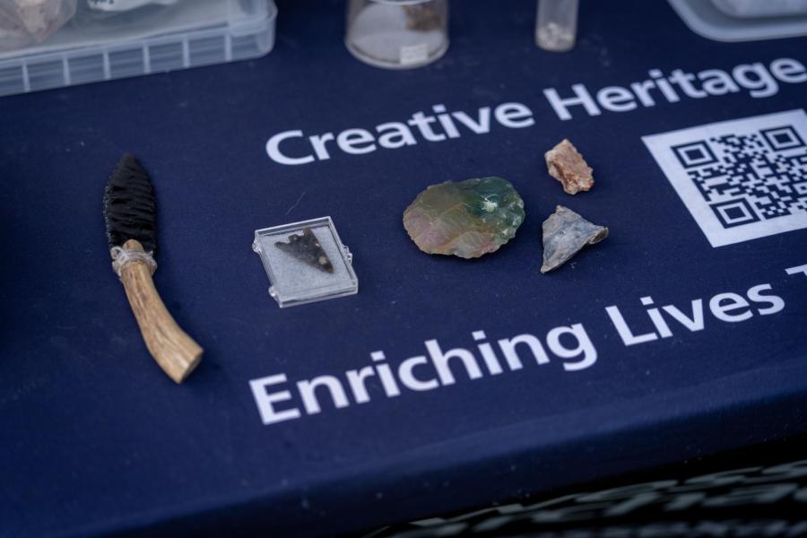 Artefacts displayed on a table at a community engagement event 