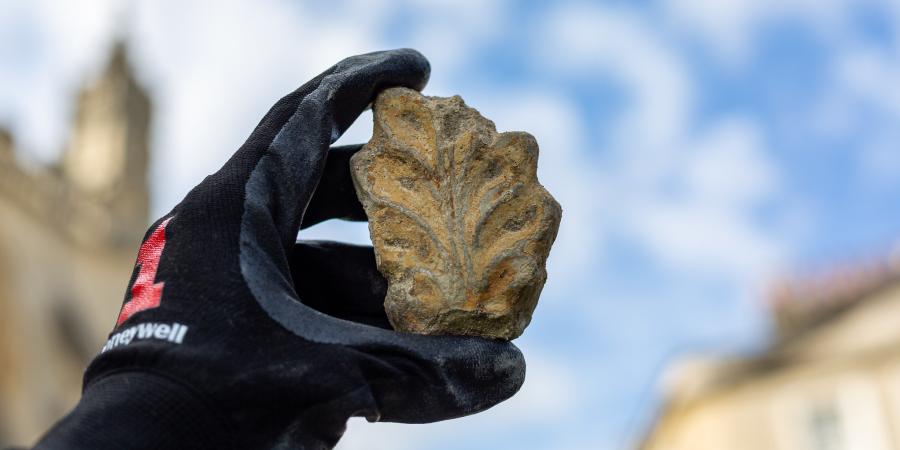 Hand holding interesting artefact