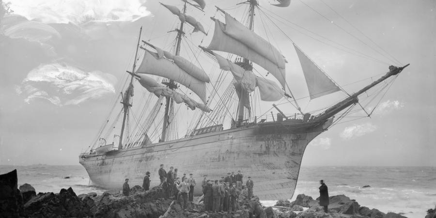 A starboard bow view of the three-masted barque Glenbervie (1866) with crowds of people, on the rocks at Lowland Point. G14146. © National Maritime Museum, Greenwich, London, Gibson's of Scilly Shipwreck Coll