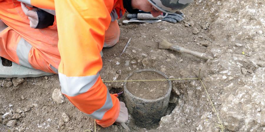 Excavating a Bronze Age vessel 