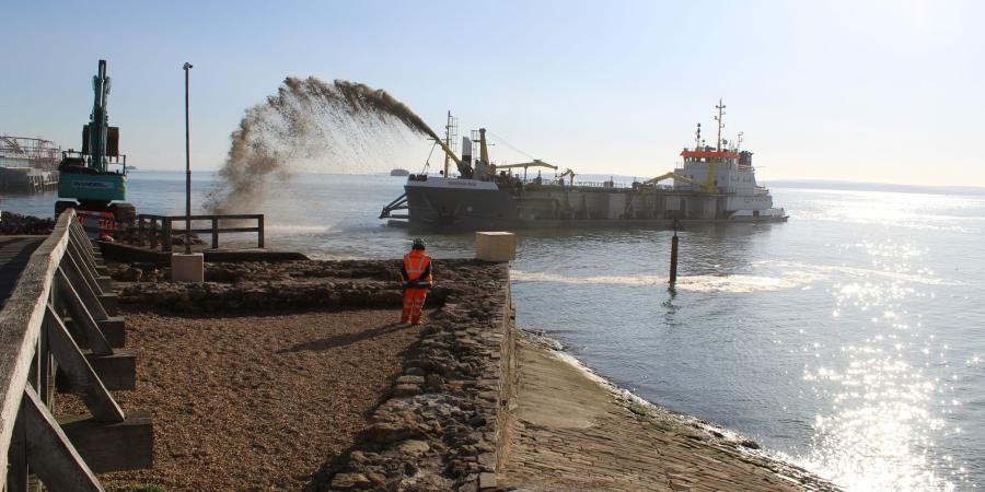 At Southsea Coastal Scheme our archaeologist looks out to sea at dredging vessel