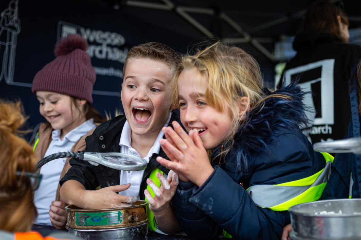 Photograph of three children - public engagement with schools at Somerset site