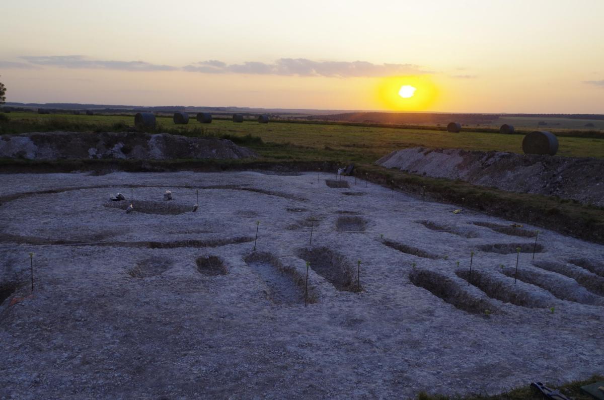 The sun sets on the final excavations at Avon camp, seen here a large grave within a ring ditch and outside, further graves in family groups