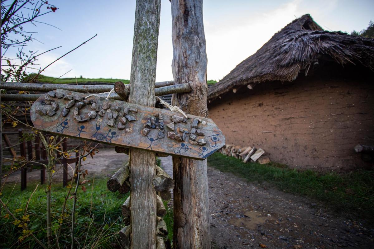 Butser's Neolithic house with Stone Age panel