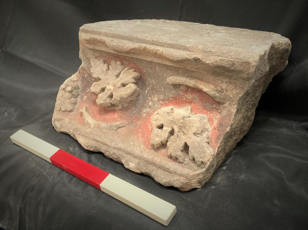 Cornice from the chest tomb carved with grape vines.