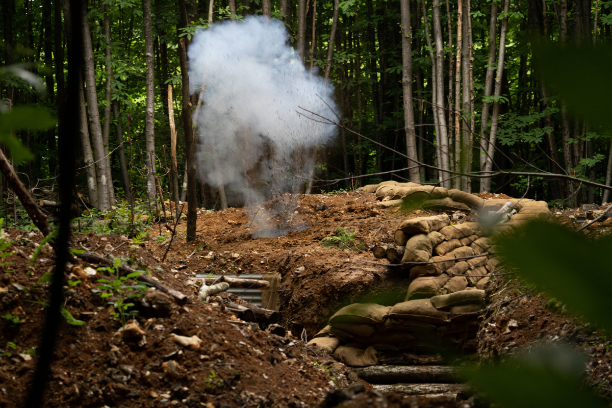 Recreating the past at CEMA - smoke emerging from a reconstructed a trench (Credit:Tommy Pengilley)