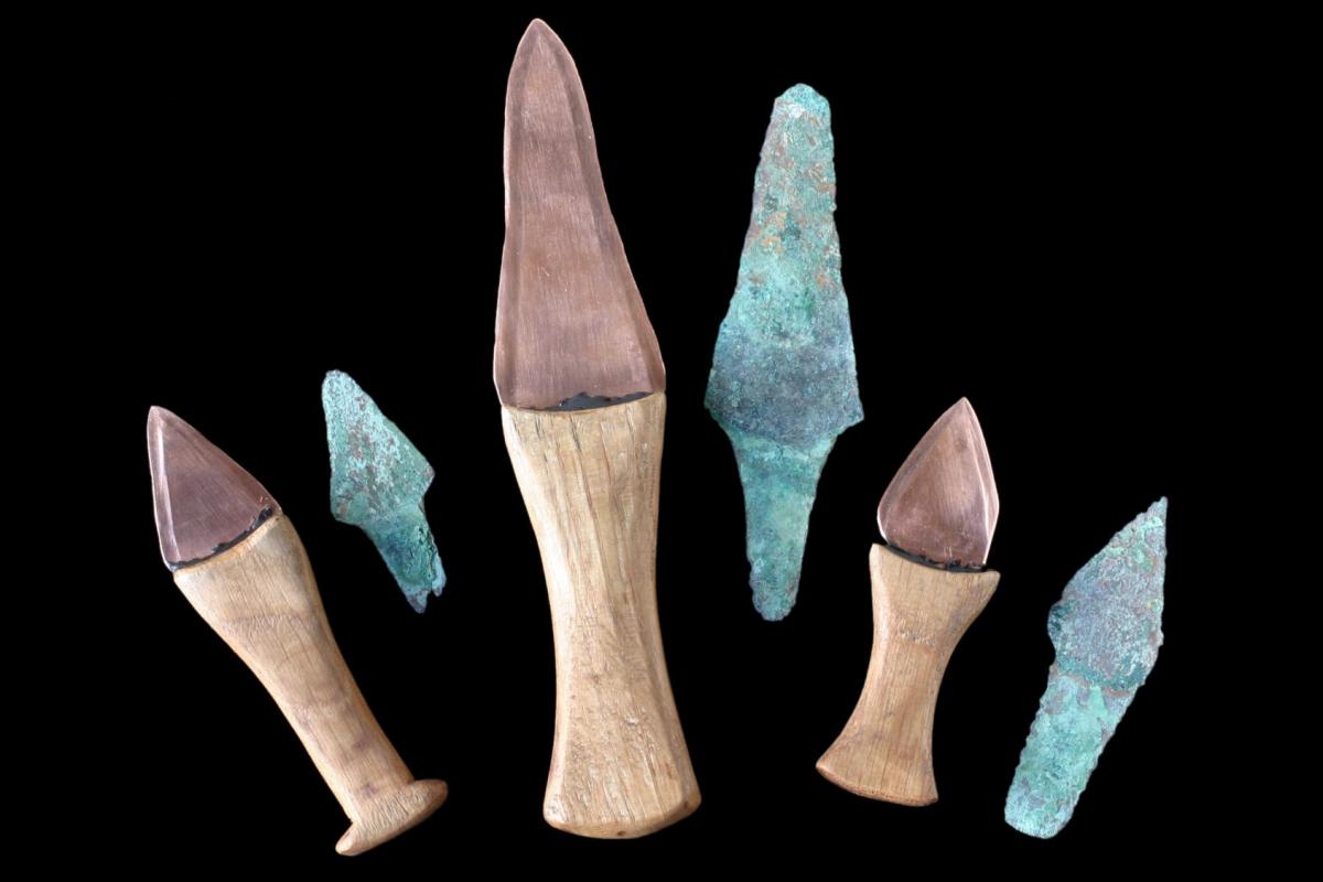 three bronze knives recovered from the Amesbury Archer grave and relicas