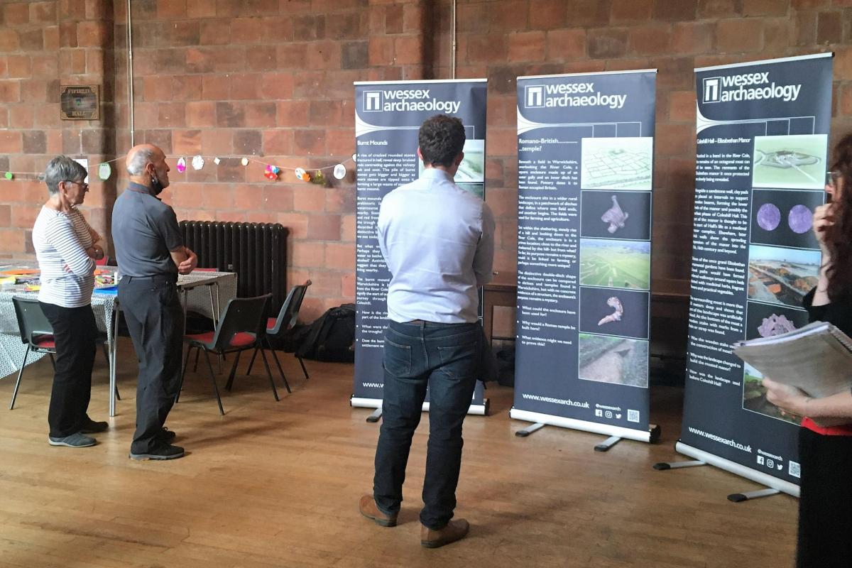 Coleshill Town Hall drop-in visitors read panels on archaeological excavations at Coleshill