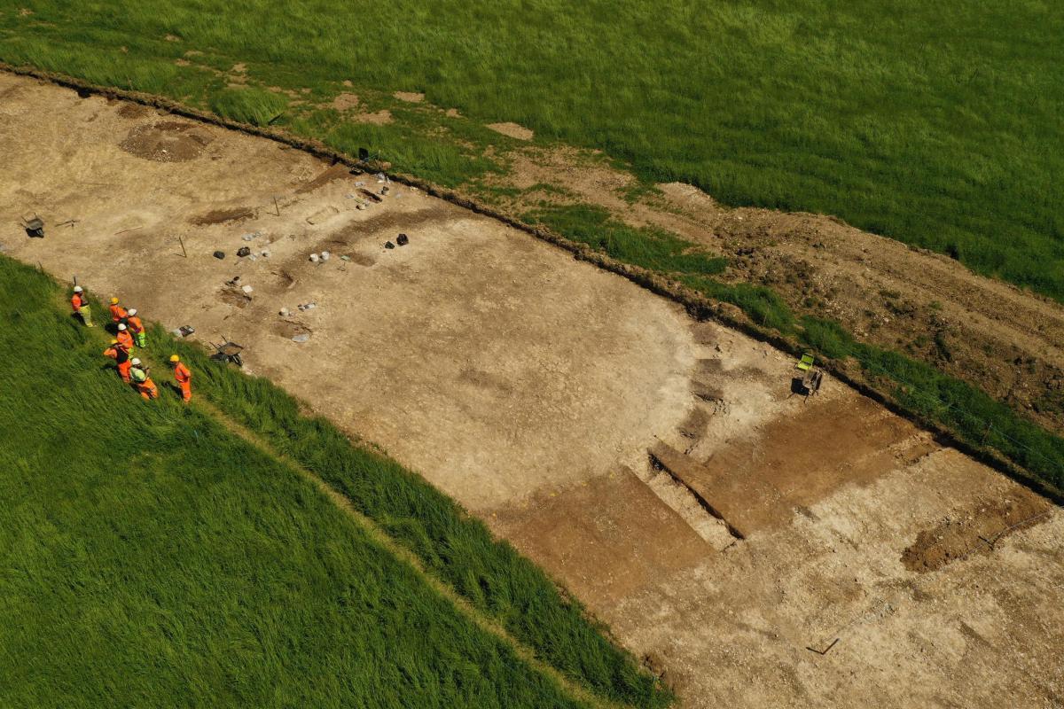 Archaeology at Viking Link, aerial image showing circular soil mark being excavated
