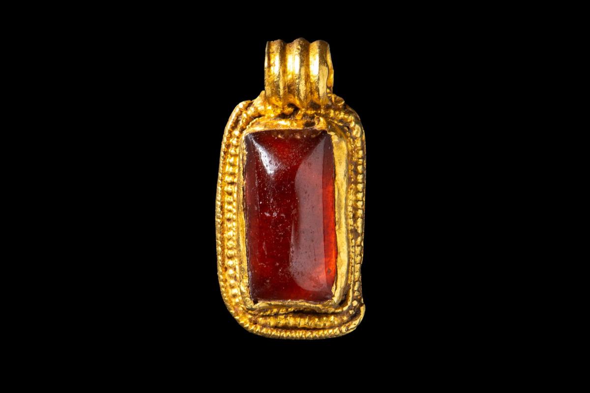 Garnet and gold pendant from the Viking Link archaeological excavations