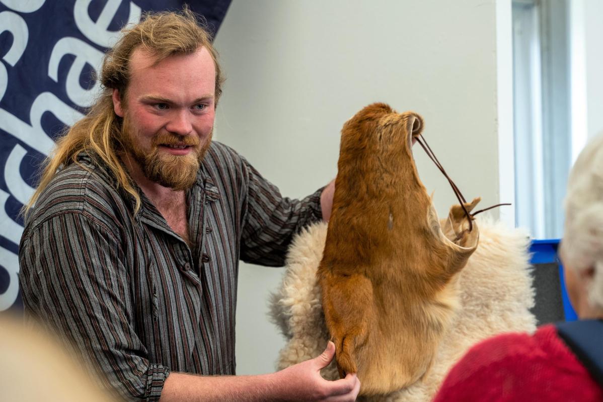 Demonstrating ancient use of animal skins at Eisteddfod yr Urdd