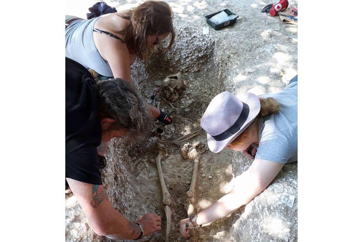 Excavating a grave