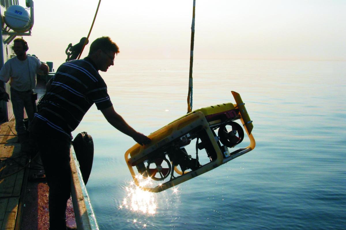 Retained Archaeologist: launching a remote sensor vehicle (ROV)
