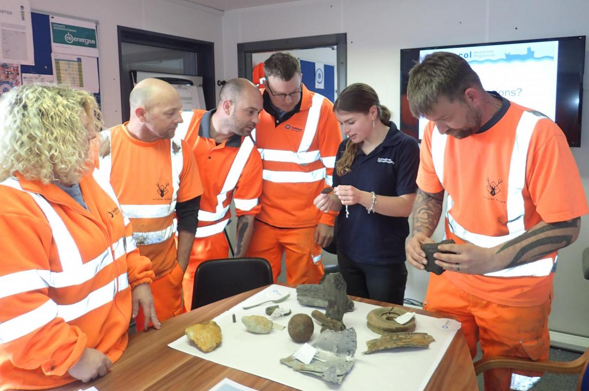 Marine Aggregate Industry crew examine archaeological finds reported through the Protocol