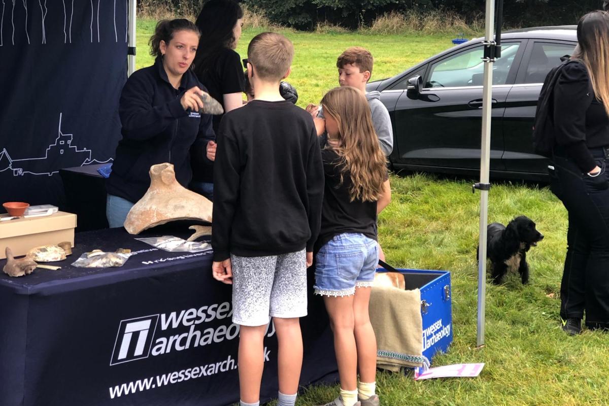 Isobel Curwen, Historic Environment Consultant, speaks to a group of children at Hidden Histories Discovery Weekend