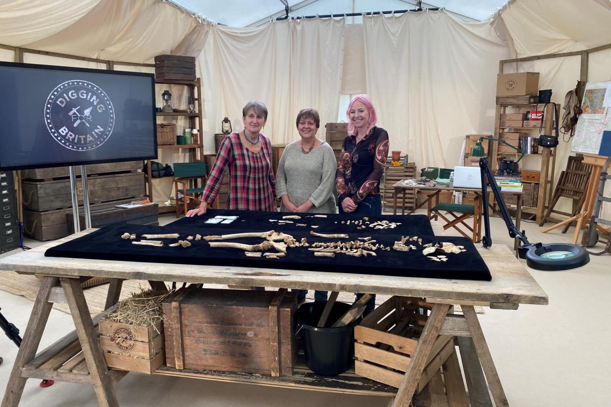 Professor Alice Roberts with osteologists Jacqueline McKinley and Ceri Boston from Wessex Archaeology in the Digging for Britain tent with two Anglo-Saxon burials 
