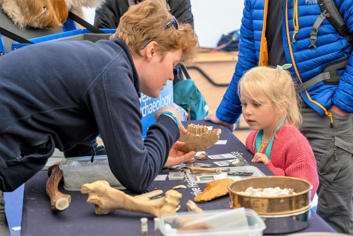 Examining artefacts at Eisteddfod yr Urdd 2022 