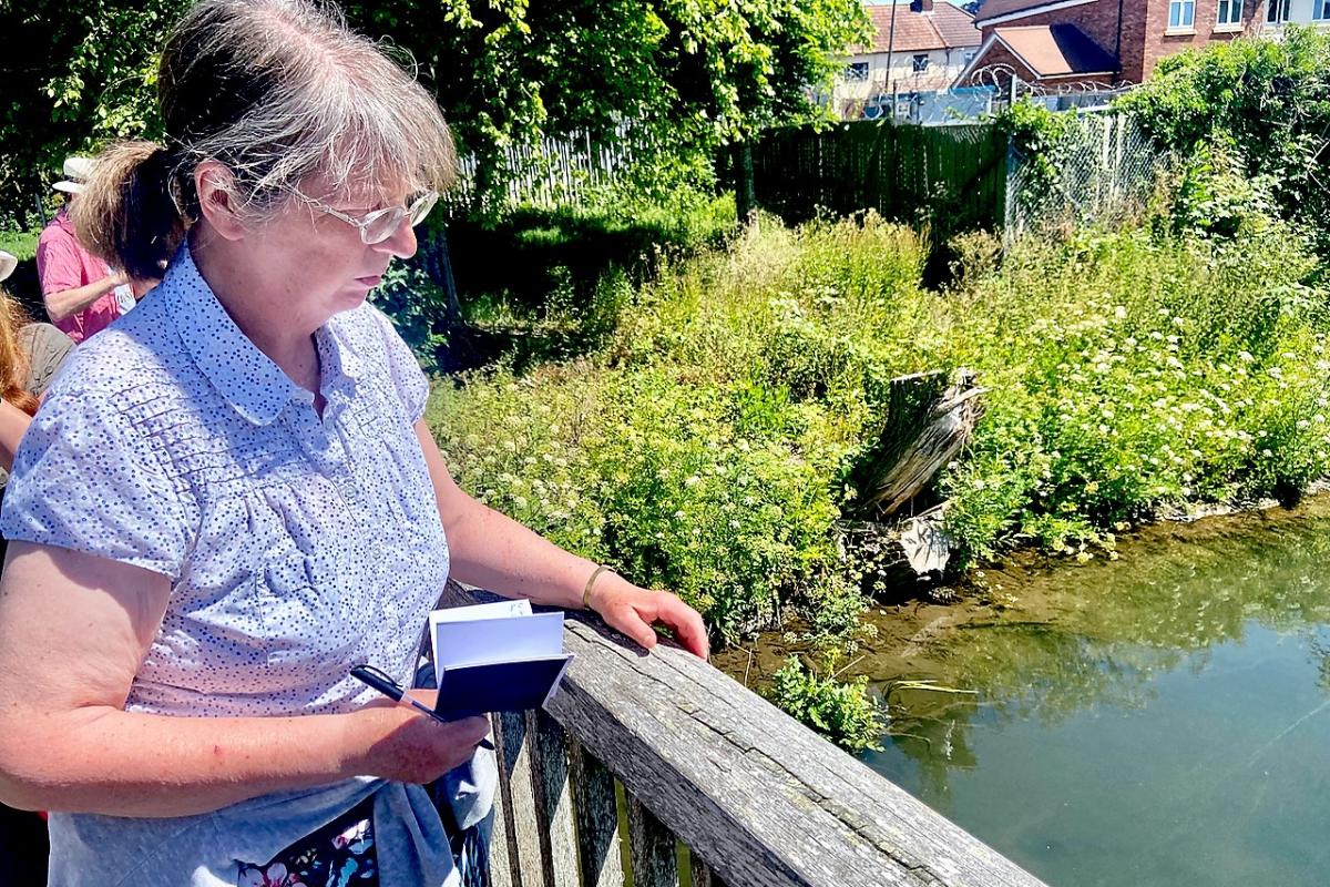 Sketching the River Avon from a bridge overlooking the river