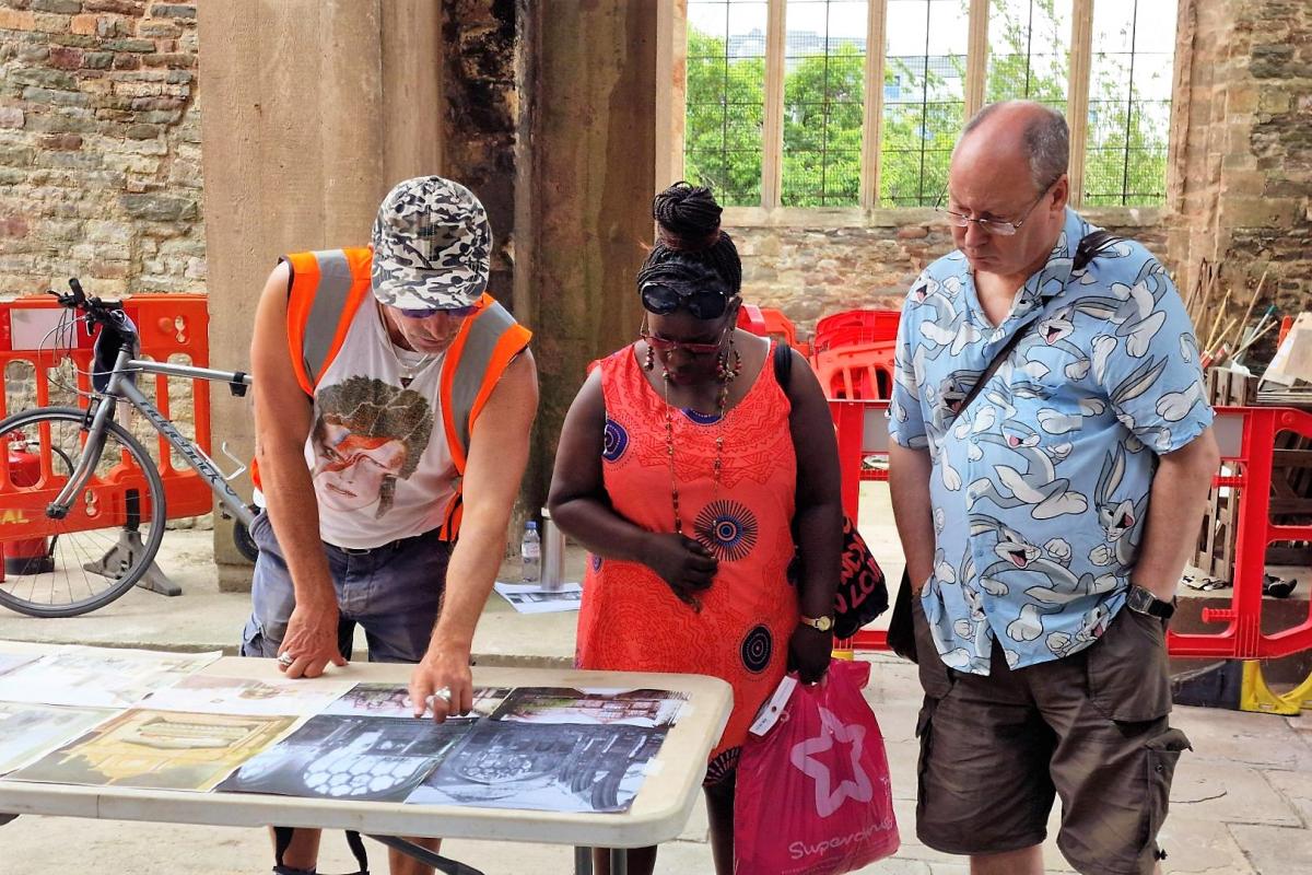 Wessex Archaeology staff discuss St Peter's Church Bristol excavation with visitors during public excavations