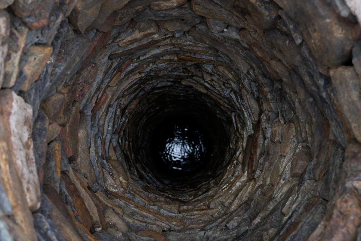 Recording inside the medieval well at Sheffield Castle, 12 m shaft with water at its base