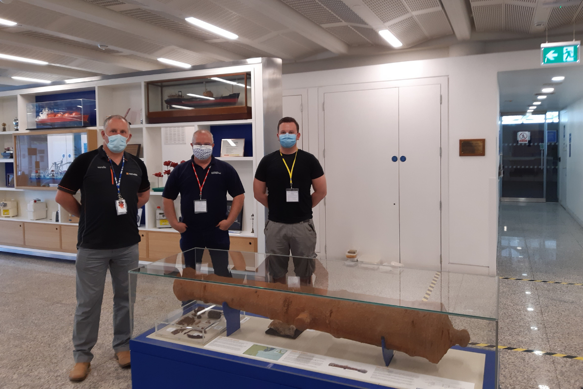 The cannon installed in its case with staff from Armour Systems and Wessex Archaeology