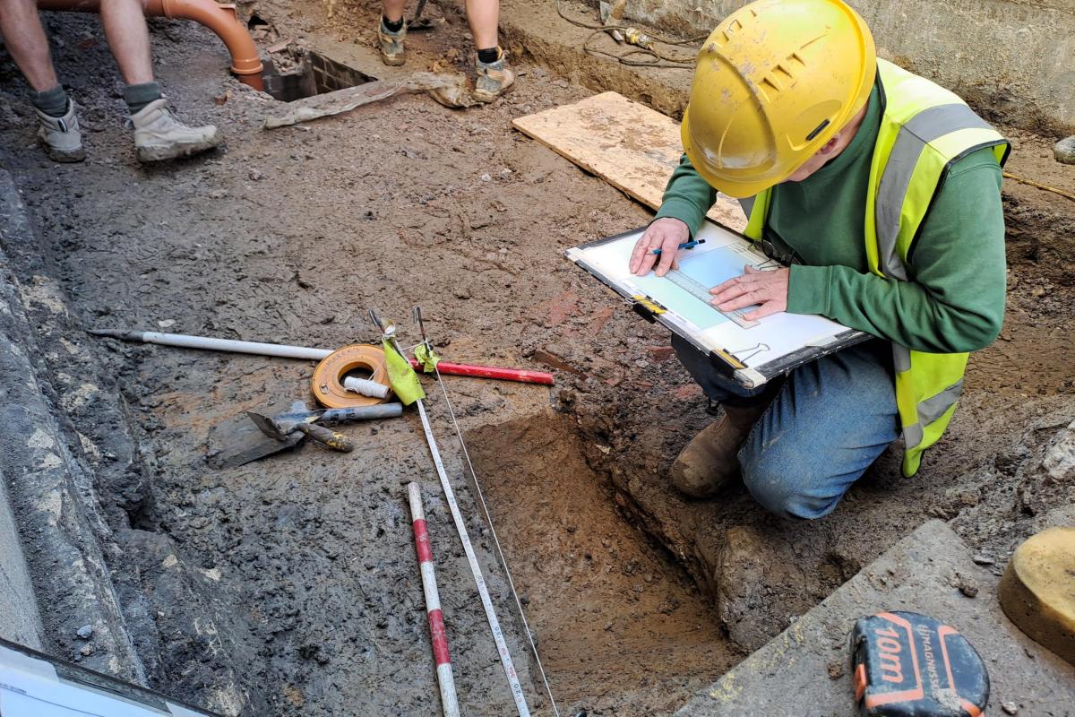 Wessex Archaeology recording a Roman ditch at Bath Assembly Rooms. Image credit National Trust, Ruth Newell