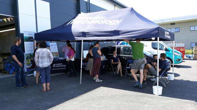 Staff and visitors outside Unit 24 during open day 
