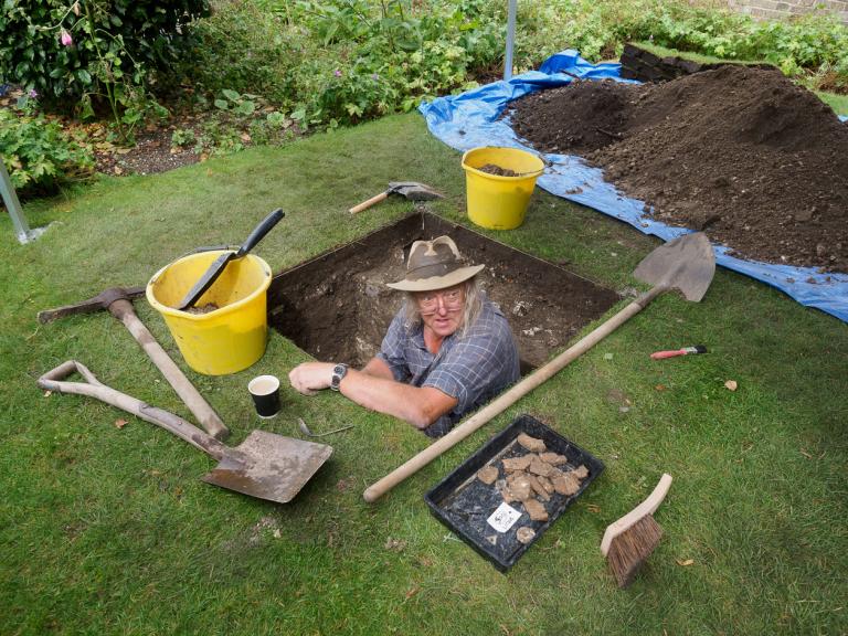 Phil Harding excavating a test pit at Salisbury Museum