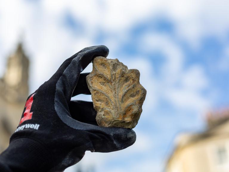 Hand holding interesting artefact