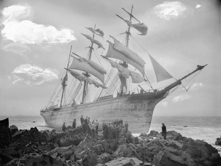 A starboard bow view of the three-masted barque Glenbervie (1866) with crowds of people, on the rocks at Lowland Point. G14146. © National Maritime Museum, Greenwich, London, Gibson's of Scilly Shipwreck Coll