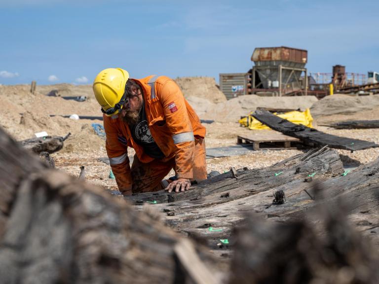 Archaeologist works on the remains on a rare Elizabethan ship found at a quarry in Kent © Wessex Archaeology