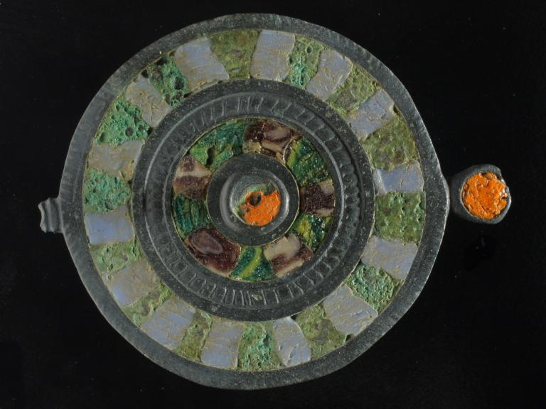 Enamelled silver disc brooch from Romano-British enclosure ditch at Poundbury Farm