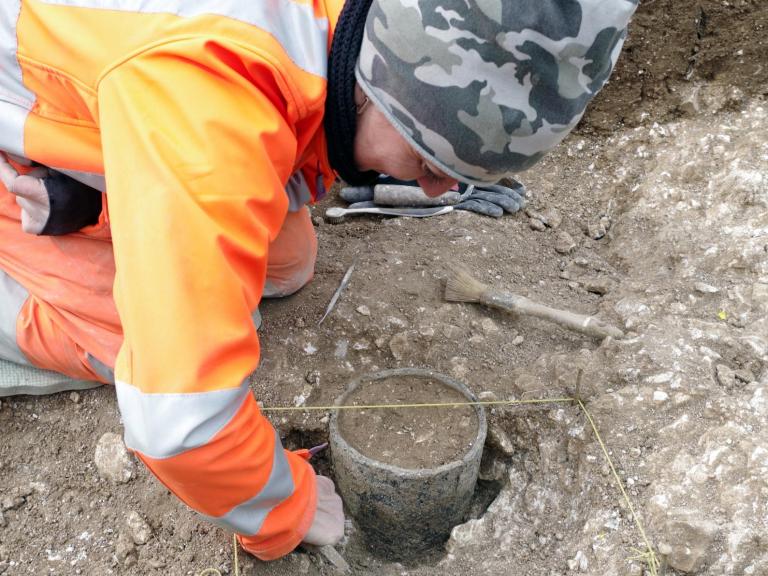 Excavating a Bronze Age vessel 