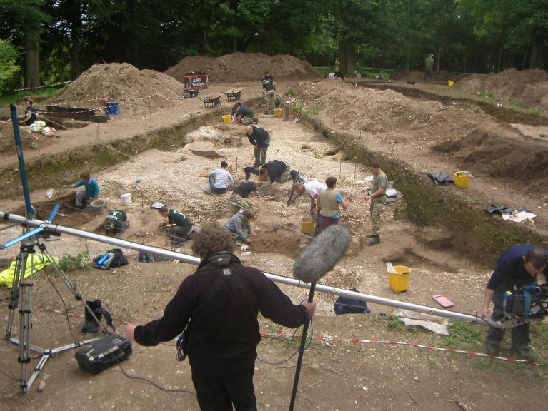 Film crew onsite during excavation work