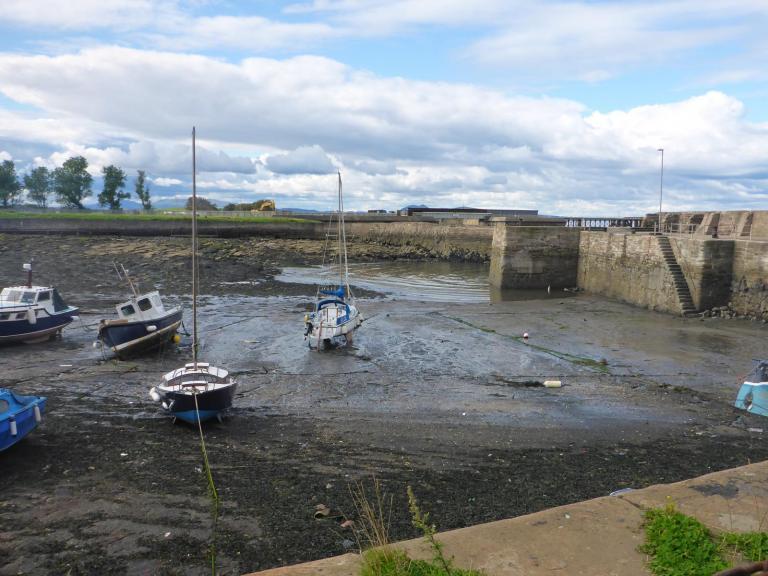 Boats in a harbour at low tide