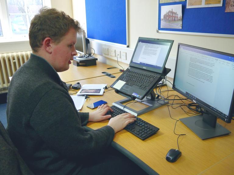 Finn working at his computer