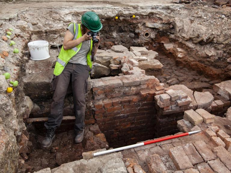 Archaeologist recording industrial archaeology at Sheffield Castle
