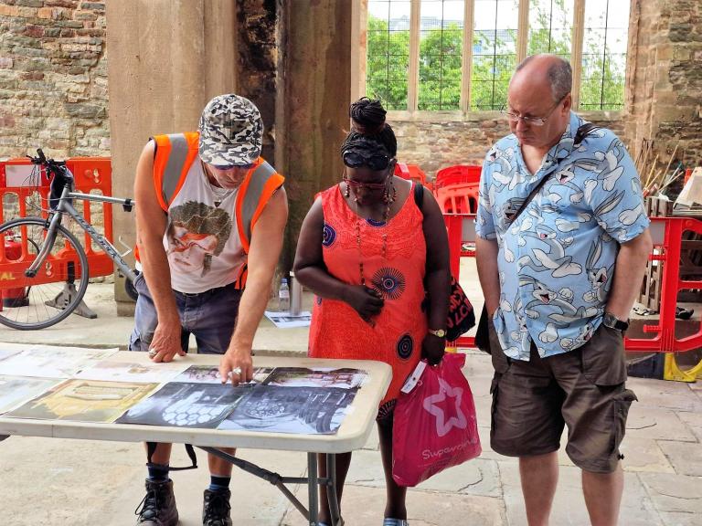 Wessex Archaeology staff discuss St Peter's Church Bristol excavation with visitors during public excavations