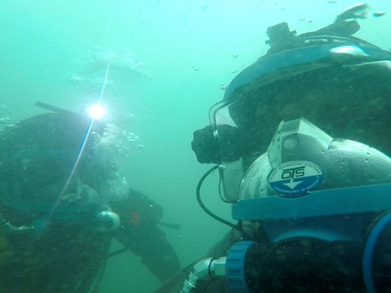 Wessex Archaeology divers examining a wreck site
