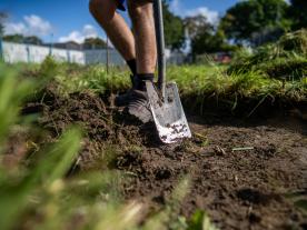Digging for Erlestoke participant wears steel-toe boots and has their spade ready