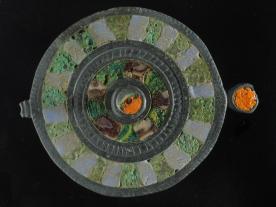 Enamelled silver disc brooch from Romano-British enclosure ditch at Poundbury Farm