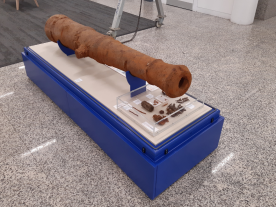 The cannon seen with accompanying artefacts (tampion etc) Credit Wessex Archaeology