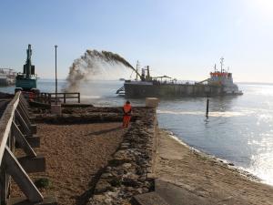 At Southsea Coastal Scheme our archaeologists looks out to sea monitoring a dredging vessel